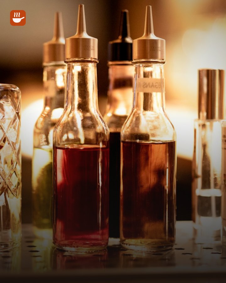 Cocktail glass and bottles on a home bar