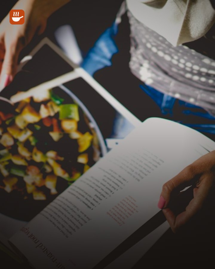 Open cookbook with recipe photos on a kitchen table